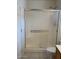 Bathroom featuring a shower with sliding glass doors and neutral tile flooring at 3454 E Bellerive Pl, Chandler, AZ 85249