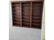 Bedroom featuring custom built-in dark wood book shelves and neutral carpeting at 3454 E Bellerive Pl, Chandler, AZ 85249