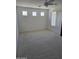 Bright carpeted bedroom with three small windows, ceiling fan and vertical blinds at 3454 E Bellerive Pl, Chandler, AZ 85249