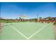 Community basketball court with shade structure and playground equipment in the background at 3756 E Waite Ln, Gilbert, AZ 85295