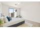 Bright bedroom featuring a plush bed, soft rug, and sliding door with access to the backyard at 3756 E Waite Ln, Gilbert, AZ 85295