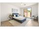 Cozy bedroom featuring a plush bed, soft rug, and sliding door with access to the backyard at 3756 E Waite Ln, Gilbert, AZ 85295