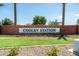 The community entrance featuring the 'Cooley Station' sign surrounded by manicured landscaping at 3756 E Waite Ln, Gilbert, AZ 85295