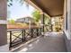 Covered front porch featuring sturdy columns and a black railing, offering a comfortable outdoor space at 3756 E Waite Ln, Gilbert, AZ 85295