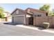 Well-kept detached garage featuring a large door and adjacent brick wall, providing secure vehicle storage at 3756 E Waite Ln, Gilbert, AZ 85295
