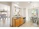 Kitchen sink with stainless steel appliances and cabinets with a view of the dining area at 3756 E Waite Ln, Gilbert, AZ 85295