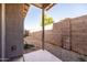 A covered patio offering a view of the backyard with a block wall at 3756 E Waite Ln, Gilbert, AZ 85295