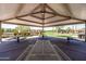 Interior view of a picnic pavilion with multiple tables and views of the community park at 3756 E Waite Ln, Gilbert, AZ 85295