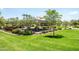 Community picnic area featuring a shade structure, tables, and manicured landscaping at 3756 E Waite Ln, Gilbert, AZ 85295