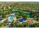 Wonderful aerial view of the community pool, lake, playground, and surrounding homes at 4024 E Maplewood St, Gilbert, AZ 85297
