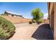 Manicured backyard featuring a gravel groundcover and block wall creating a private outdoor space at 4024 E Maplewood St, Gilbert, AZ 85297