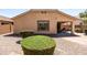 Low-maintenance desert backyard with rock and gravel landscaping, shrubbery, and privacy fence at 4024 E Maplewood St, Gilbert, AZ 85297