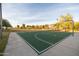 Community basketball court with a well-maintained playing surface and hoop, surrounded by landscaping at 4024 E Maplewood St, Gilbert, AZ 85297