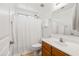 Clean bathroom featuring a shower, sink and a large vanity mirror at 4024 E Maplewood St, Gilbert, AZ 85297