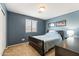 Cozy bedroom featuring stylish furnishings and neutral carpet and walls at 4024 E Maplewood St, Gilbert, AZ 85297
