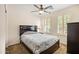 Comfortable bedroom with a ceiling fan, carpet and bright natural light at 4024 E Maplewood St, Gilbert, AZ 85297
