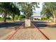 Well-manicured community center known as 'The Barn,' featuring lush landscaping and pristine architecture at 4024 E Maplewood St, Gilbert, AZ 85297