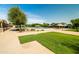 Lovely community pool area featuring lounge seating, shade, and nearby picnic benches at 4024 E Maplewood St, Gilbert, AZ 85297