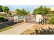 Trailside Park pool entrance with dark metal fence, rules posted, and shade sails in the background at 4024 E Maplewood St, Gilbert, AZ 85297