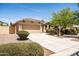 Inviting curb appeal with a lovely front yard and a convenient two-car garage at 4024 E Maplewood St, Gilbert, AZ 85297