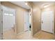 Inviting hallway leading to bathroom and bedroom with tile flooring at 4024 E Maplewood St, Gilbert, AZ 85297