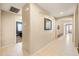 Neutral hallway with art that leads to bedrooms and living spaces at 4024 E Maplewood St, Gilbert, AZ 85297