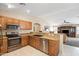 Kitchen showcasing granite counters, stainless appliances, and open layout at 4024 E Maplewood St, Gilbert, AZ 85297