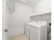 Bright laundry room features a washer, dryer and storage space at 4024 E Maplewood St, Gilbert, AZ 85297