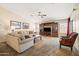 Spacious living room with a ceiling fan and a large decorative entertainment center at 4024 E Maplewood St, Gilbert, AZ 85297