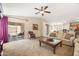 Bright living room with sliding glass doors leading to the patio at 4024 E Maplewood St, Gilbert, AZ 85297