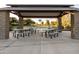 Shaded picnic area with multiple tables and seating for outdoor community gatherings at 4024 E Maplewood St, Gilbert, AZ 85297