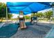 Playground with slides, climbing structures, and shaded seating, offering outdoor recreation at 4024 E Maplewood St, Gilbert, AZ 85297