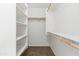 Organized walk-in closet with shelving and rods for ample storage at 4024 E Maplewood St, Gilbert, AZ 85297