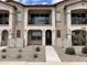 Charming townhome featuring a welcoming front porch and balcony, enhancing curb appeal at 4073 E Amoroso Dr, Gilbert, AZ 85296