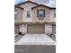 Townhome featuring attached garages and classic design elements at 4073 E Amoroso Dr, Gilbert, AZ 85296