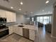 Modern kitchen with stainless appliances, granite countertops, and an open-concept design at 4073 E Amoroso Dr, Gilbert, AZ 85296