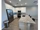 Modern kitchen featuring stainless steel appliances and granite countertops, with breakfast bar at 4073 E Amoroso Dr, Gilbert, AZ 85296