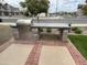 Built-in outdoor grill with brick trim, perfect for entertaining in the backyard at 4073 E Amoroso Dr, Gilbert, AZ 85296
