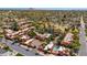 Aerial view of a charming neighborhood featuring lush greenery, community park, and private pools at 4203 E Hazelwood St, Phoenix, AZ 85018