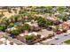 Stunning aerial view of a desert community featuring lush landscaping, pools, and charming architecture at 4203 E Hazelwood St, Phoenix, AZ 85018