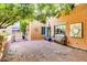 Inviting courtyard with brick-paved ground, desert landscaping, and outdoor seating area at 4203 E Hazelwood St, Phoenix, AZ 85018