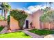 Charming home exterior with lush landscaping, a beautiful garden, and a brick walkway at 4203 E Hazelwood St, Phoenix, AZ 85018