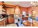 Charming kitchen with custom cabinets, stainless steel appliances, and cozy breakfast nook at 4203 E Hazelwood St, Phoenix, AZ 85018