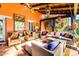 Cozy covered patio featuring wicker furniture, colorful decor, and relaxing ambiance at 4203 E Hazelwood St, Phoenix, AZ 85018