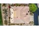 Aerial view of the property highlighting a large patio area, landscaping, and an tile roof at 42109 N Astoria Way, Anthem, AZ 85086