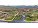 Community aerial showcasing landscaped grounds, golf course, and an elegant entryway at 42109 N Astoria Way, Anthem, AZ 85086