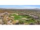Expansive aerial view of a golf course community showcasing lush fairways, desert landscaping, and residential homes at 42109 N Astoria Way, Anthem, AZ 85086