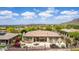 Exterior view showcasing the covered patio and well-maintained landscaping with a desert view at 42109 N Astoria Way, Anthem, AZ 85086