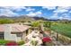 Inviting backyard with lush landscaping, desert plants, comfortable seating areas, and a scenic golf course view at 42109 N Astoria Way, Anthem, AZ 85086