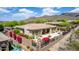 Manicured backyard and patio area surrounded by desert landscaping and flowering shrubs, ideal for outdoor enjoyment at 42109 N Astoria Way, Anthem, AZ 85086